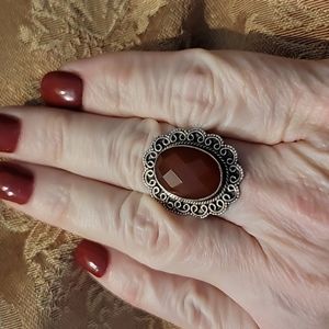 Beautiful silver tone ring with burnt orange jewel, size 8.5